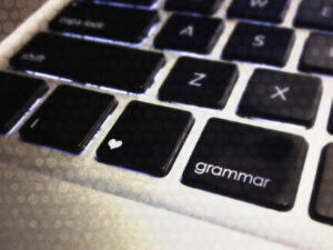 English keyboard with a heart on the windows key and "grammar" on the alt key